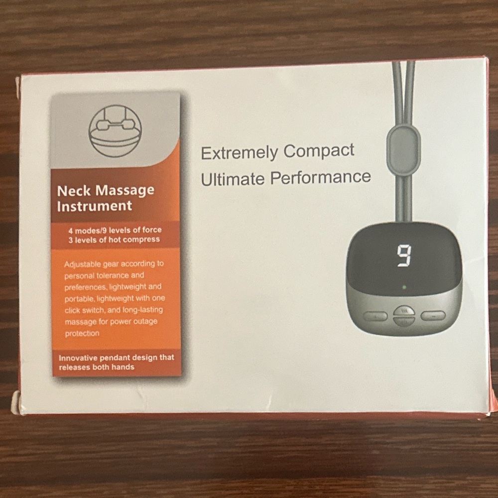 NEW / BNIB Extremely compact hanging electric pulse neck massager with heat